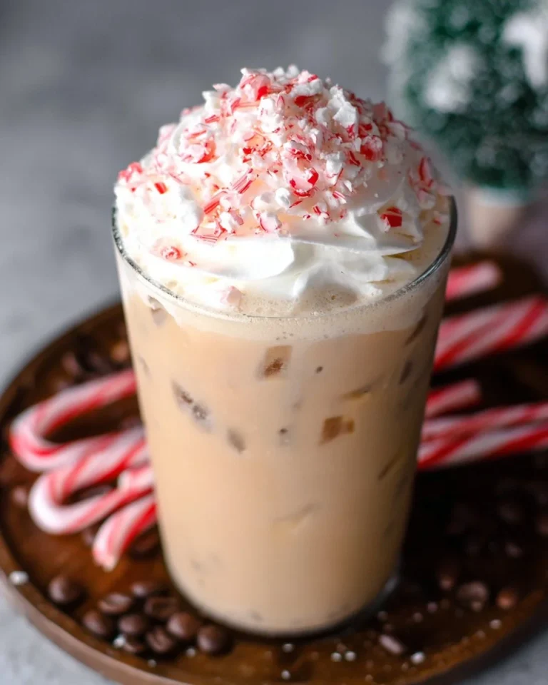 Iced Peppermint Mocha topped with whipped cream and peppermint sprinkles