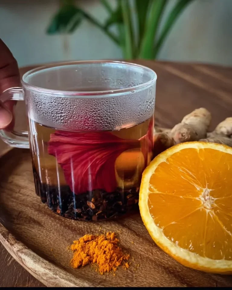Cup of hibiscus tea with ginger and turmeric for health benefits