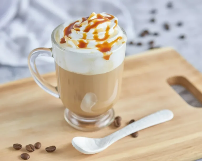 Delicious Caramel Brûlée Coffee topped with whipped cream and caramel drizzles.