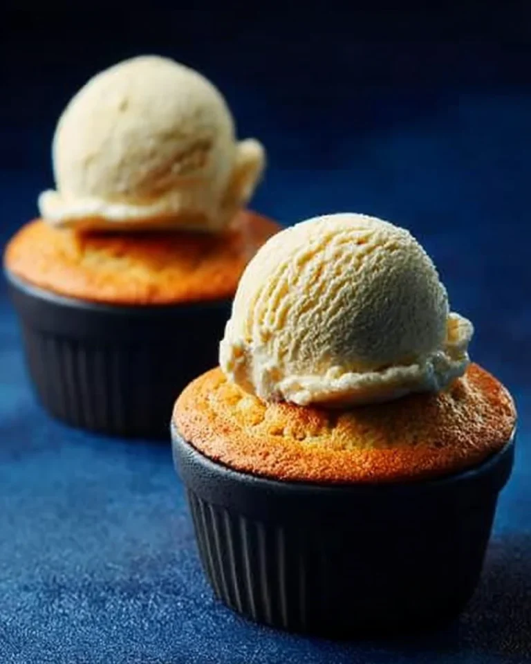 Delicious no-fail lemon souffles served in elegant dishes on a table.