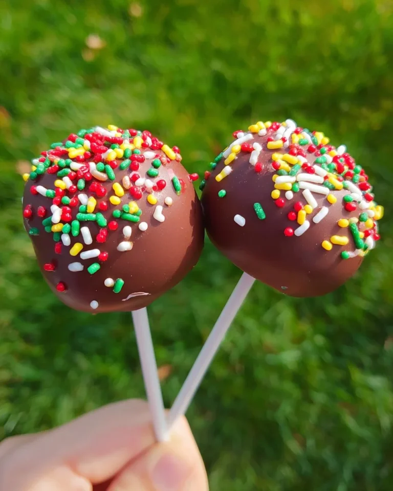 Decorated simple cake pops on a colorful serving platter